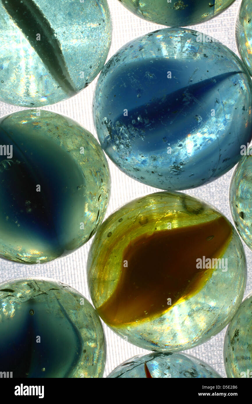 Colourful marbles on a white background Stock Photo - Alamy