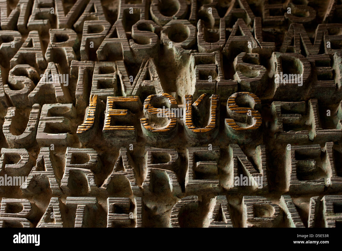 The word JESUS carved into a huge door on the Sagrada Familia Basilica in Barcelona Stock Photo