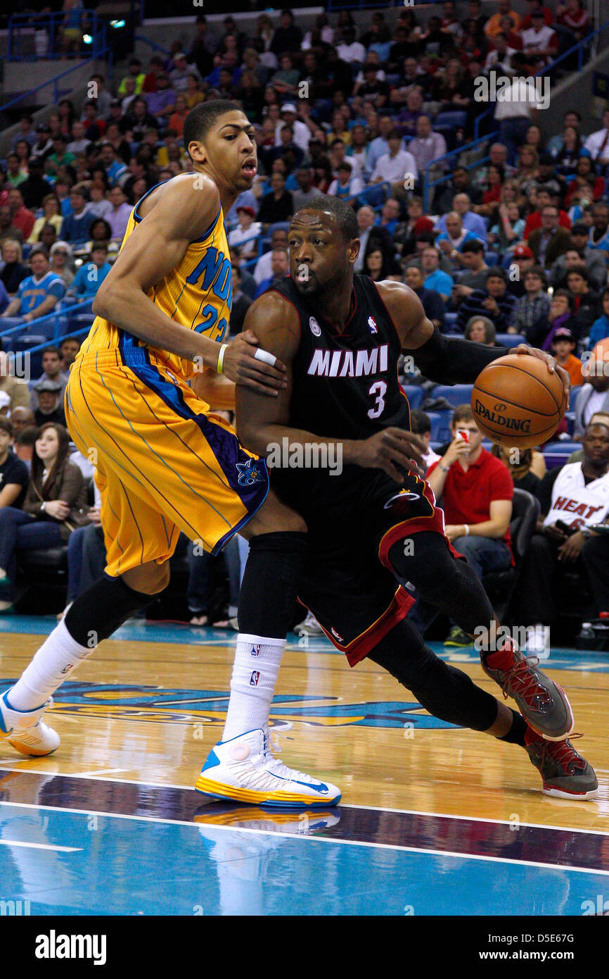March 29, 2013 - New Orleans, Louisiana, United States of America - March 29, 2013: Miami Heat shooting guard Dwyane Wade (3) drives against New Orleans Hornets power forward Anthony Davis (23) during the NBA basketball game between the New Orleans Hornets and the Miami Heat at the New Orleans Arena in New Orleans, LA. Stock Photo