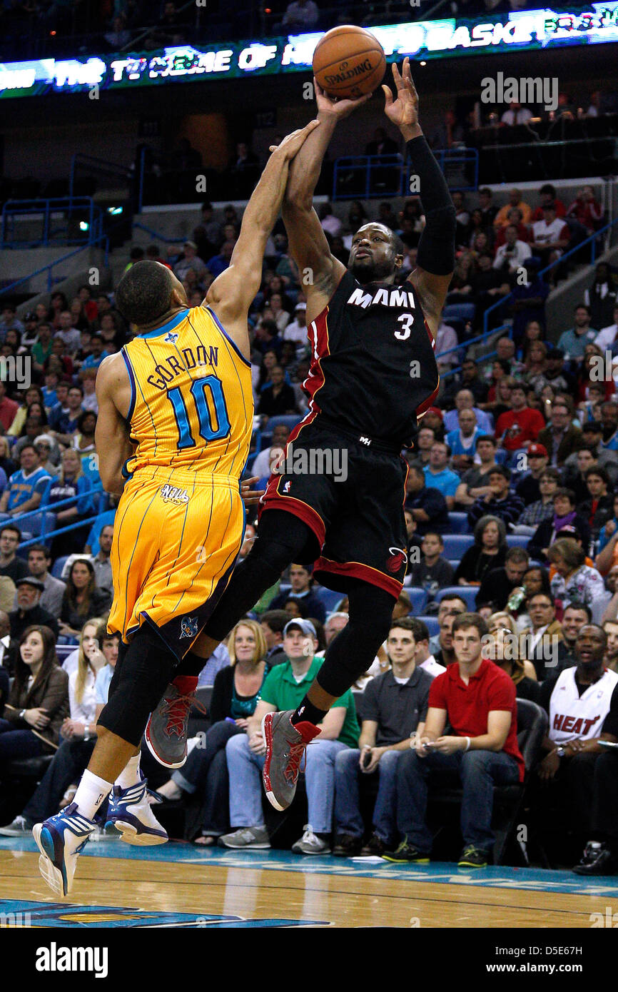March 29, 2013 - New Orleans, Louisiana, United States of America - March 29, 2013: Miami Heat shooting guard Dwyane Wade (3) shoot over New Orleans Hornets shooting guard Eric Gordon (10) during the NBA basketball game between the New Orleans Hornets and the Miami Heat at the New Orleans Arena in New Orleans, LA. Stock Photo