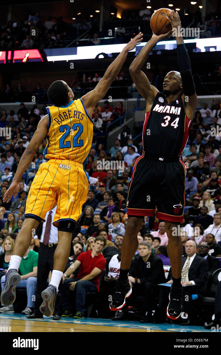 March 29, 2013 - New Orleans, Louisiana, United States of America - March 29, 2013: Miami Heat shooting guard Ray Allen (34) shoots over New Orleans Hornets point guard Brian Roberts (22) during the NBA basketball game between the New Orleans Hornets and the Miami Heat at the New Orleans Arena in New Orleans, LA. Stock Photo
