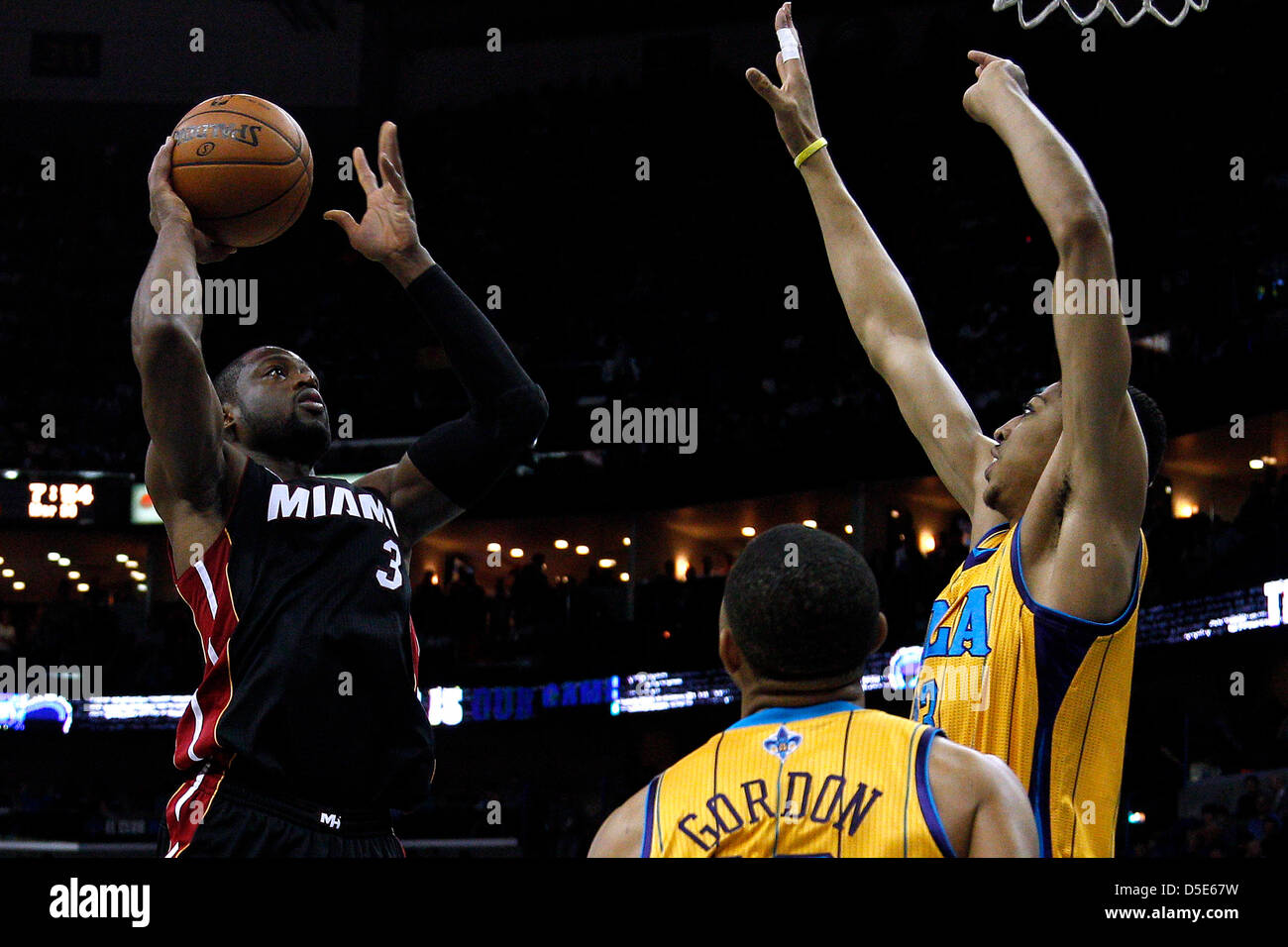 March 29, 2013 - New Orleans, Louisiana, United States of America - March 29, 2013: Miami Heat shooting guard Dwyane Wade (3) shoots over New Orleans Hornets power forward Anthony Davis (23) during the NBA basketball game between the New Orleans Hornets and the Miami Heat at the New Orleans Arena in New Orleans, LA. Stock Photo