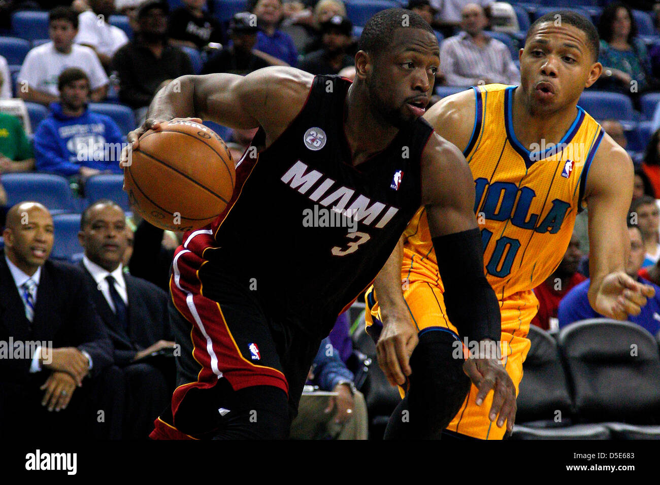 March 29, 2013 - New Orleans, Louisiana, United States of America - March 29, 2013: Miami Heat shooting guard Dwyane Wade (3) drives against New Orleans Hornets shooting guard Eric Gordon (10) during the NBA basketball game between the New Orleans Hornets and the Miami Heat at the New Orleans Arena in New Orleans, LA. Stock Photo