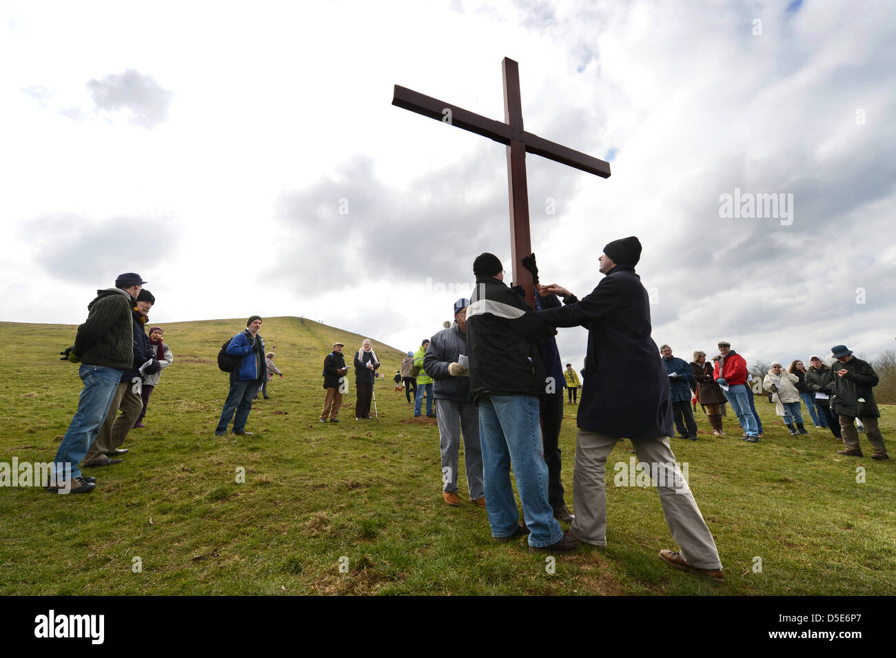 Local parishioners from the Cam and Durley District Churches Together Group make their annual Easter procession carrying a cross from Dursley to the top of Cam Peak in Gloucestershire (29 Mar 2013). Stock Photo
