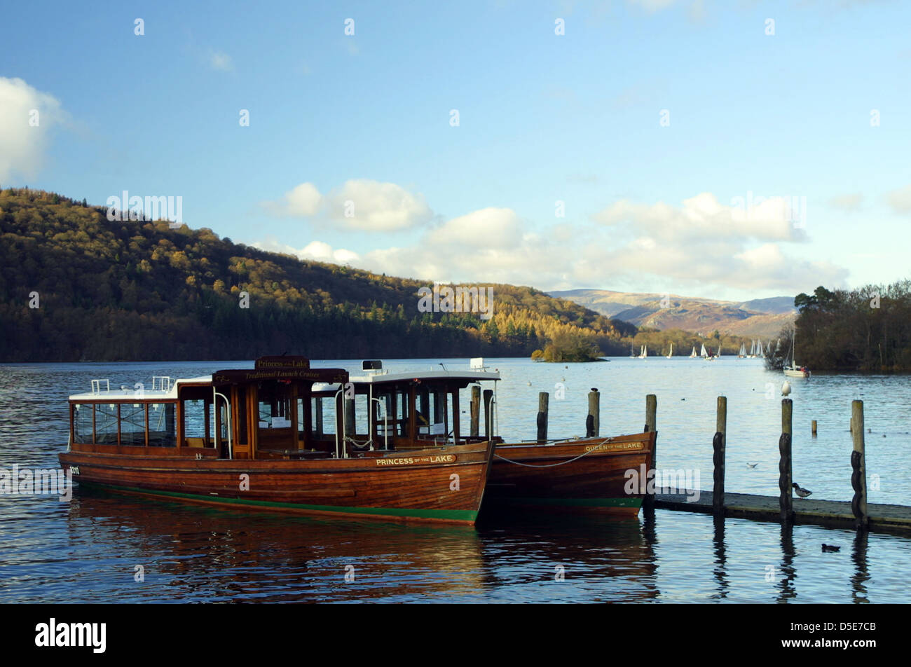 Tourist boats docked at a pier on Lake Windermere Stock Photo
