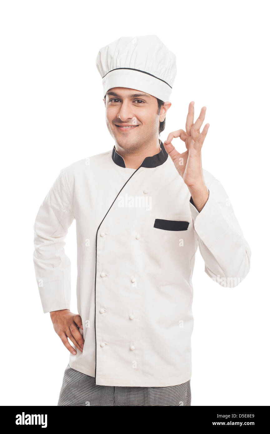 Portrait of a male chef showing ok sign and smiling Stock Photo