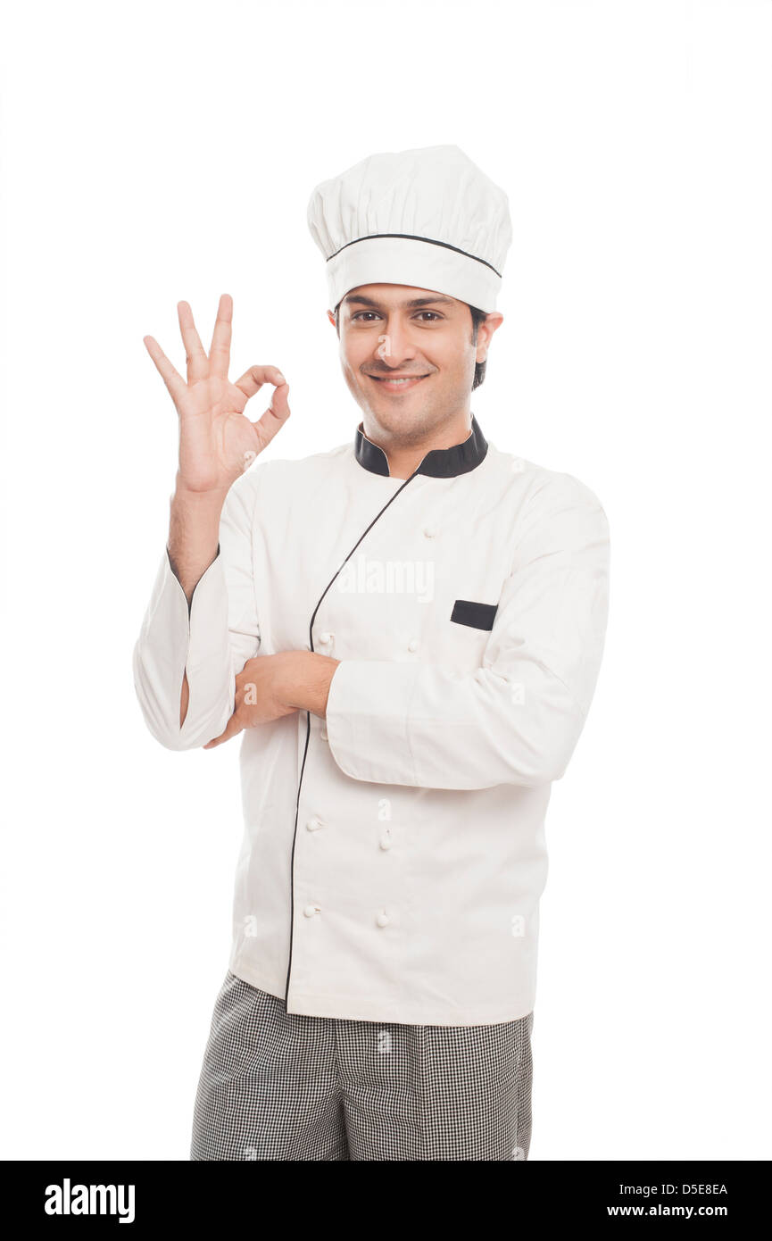 Portrait of a male chef showing ok sign and smiling Stock Photo