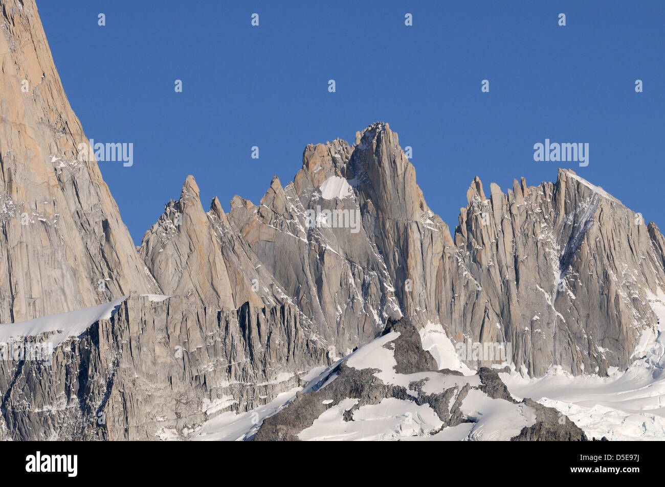 Aguja Mermoz,.The flank of Mount Fitzroy is to the left.  To the right of Mount Fitzroy are Aguja Val de Vois, Aguja Mermoz, Stock Photo