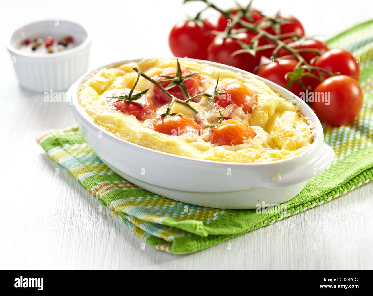 Tomato gratin with cheese and zucchini Stock Photo Alamy