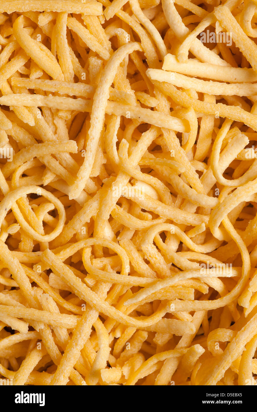 yellow dried pasta background or food texture Stock Photo
