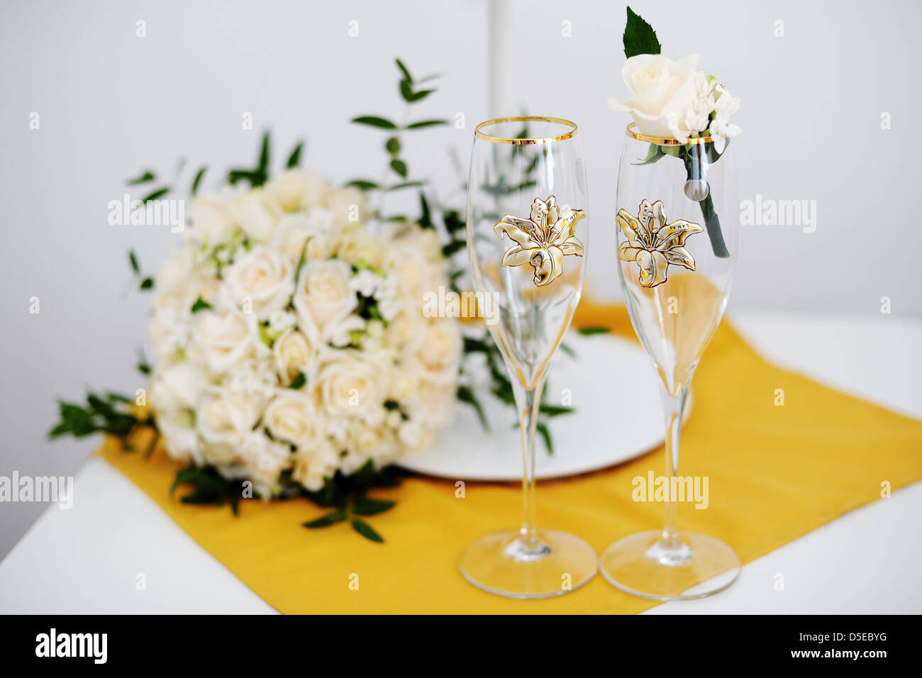 Two Decorated Wedding Glasses With A Groom Boutonniere And The