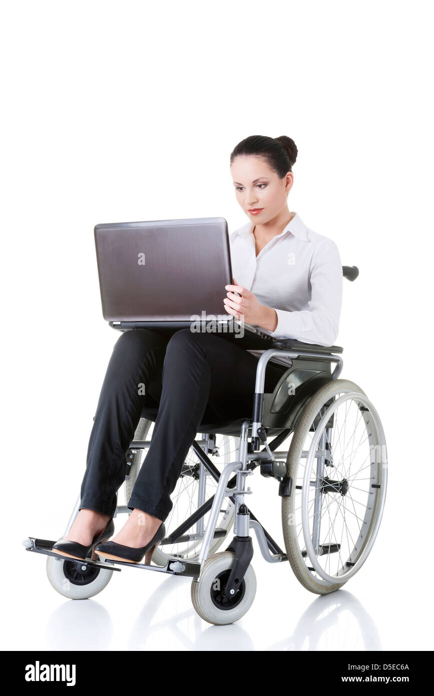 Attractive smiling disabled businesswoman sitting in a wheel chair ...