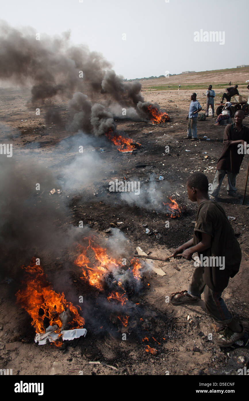 Burning electronic waste in Agbogbloshie dump, Accra, Ghana. Stock Photo