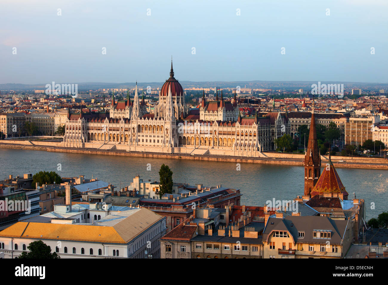 Hungarian Parliament Building at sunset by the Danube river in the city of Budapest, Hungary. Stock Photo