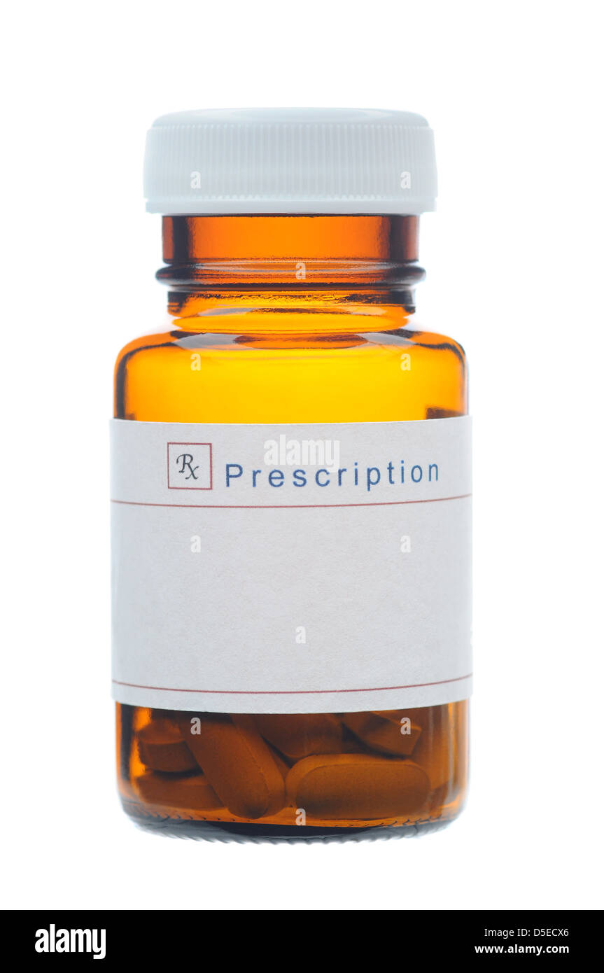 Closeup of a Glass Prescription bottle with a blank label, Brown bottle with pills isolated on white. Stock Photo