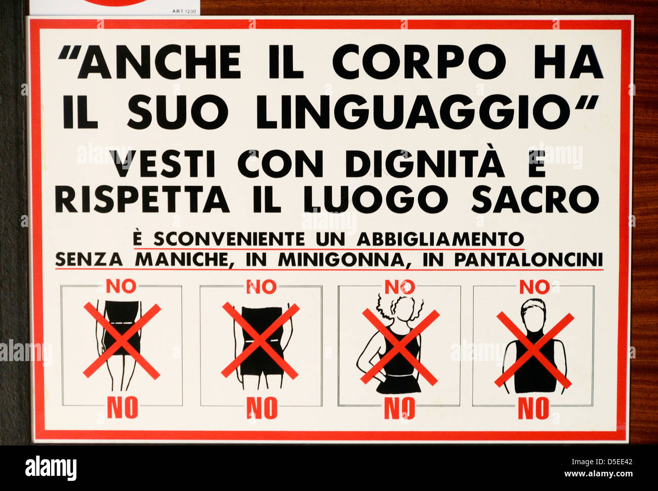 Repressive dress code sign in a church in Riva del Garda, Italy. Stock Photo