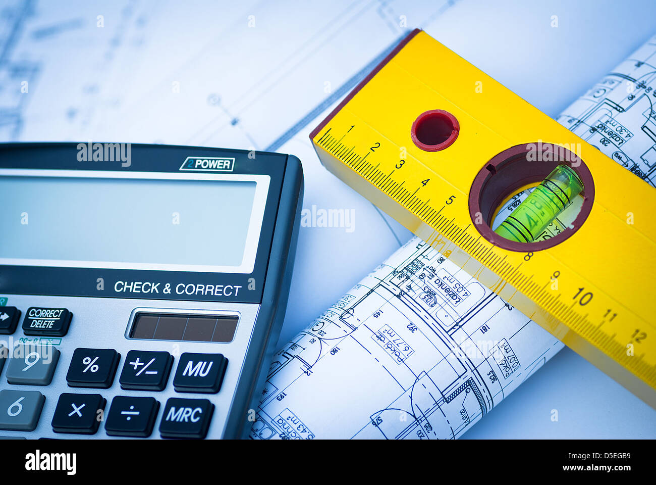 Construction rolls and plans and yellow helmet Stock Photo - Alamy