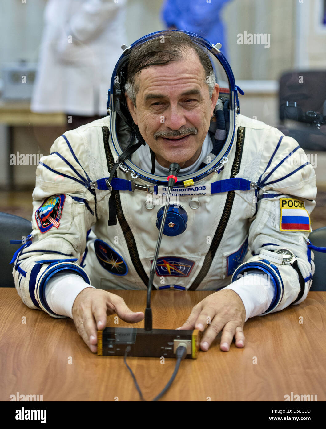 Expedition 35 Soyuz Commander Pavel Vinogradov is seen talking to ...