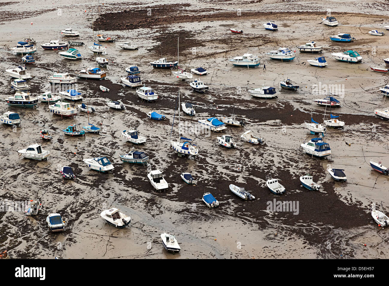 Boats resting on harbour sands at low tide, Gorey, Jersey, Channel