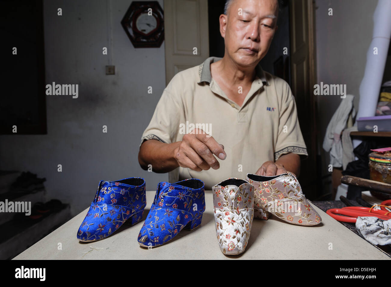 Artisan making shoes for "bound feet", Melaka, Malaysia, Asia Stock
