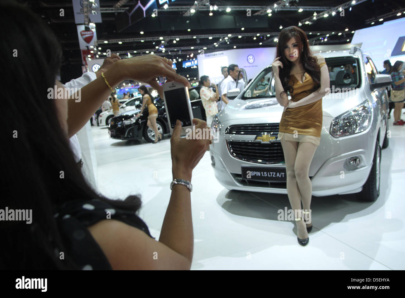 29 Mar 2013 . Bangkok , Thailand . Presenter posing with Chevrolet spin 2013 . The 34th Bangkok International Motor Show will be held from March 27 to April 7 Stock Photo