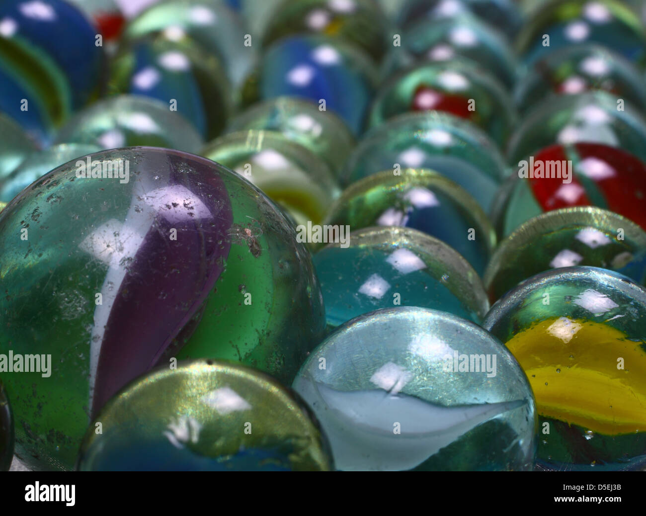 Colourful marbles on a white background Stock Photo - Alamy