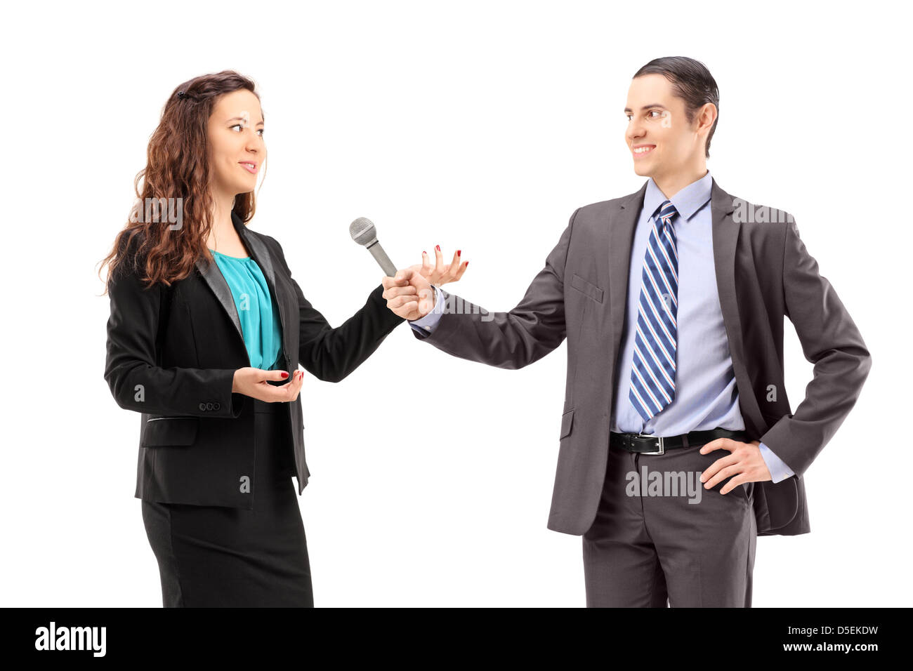 A businesswoman and male reporter having an interview, isolated on white background Stock Photo