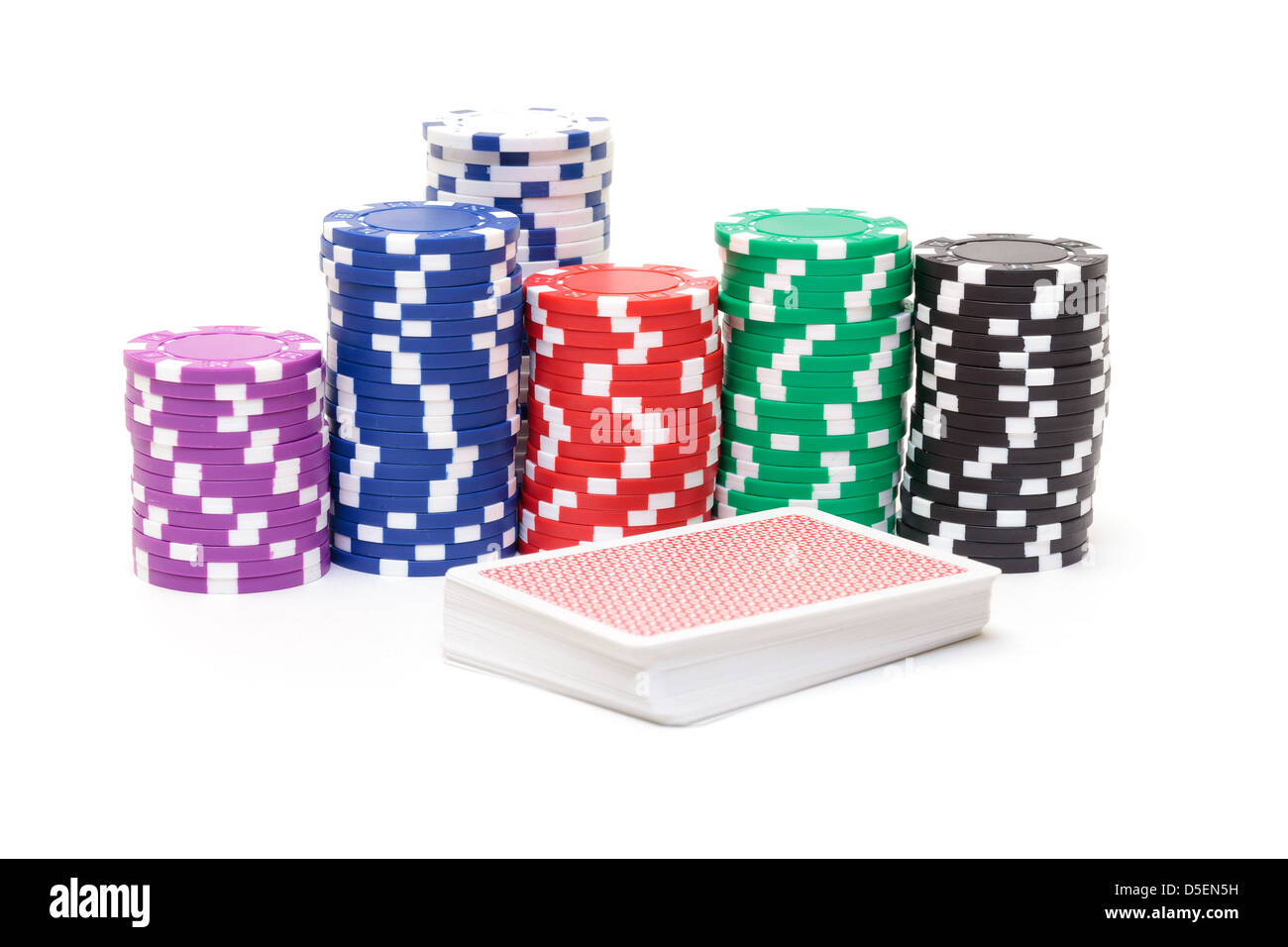 Stacks of Poker Chips with Playing Cards, closeup on white background Stock Photo