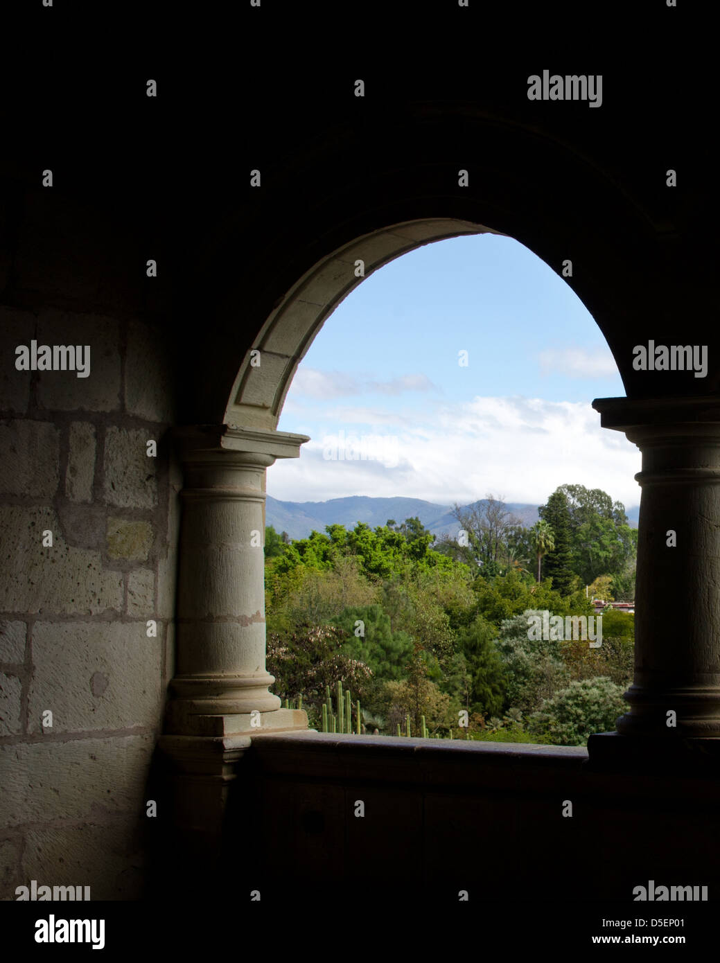 View from a stone arched balcony in the Centro Cultural Santo Domingo out to the distant mountains, Oaxaca, Mexico Stock Photo