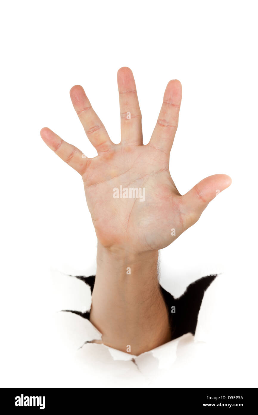 Hand through a hole in paper Stock Photo Alamy