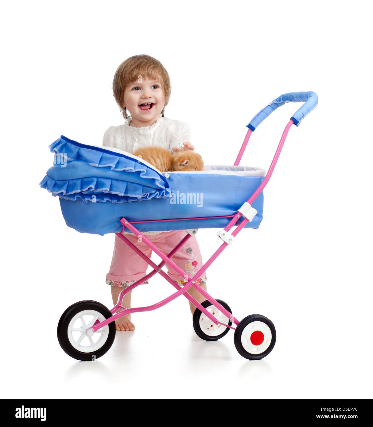 girl with buggy and kitten inside Stock Photo