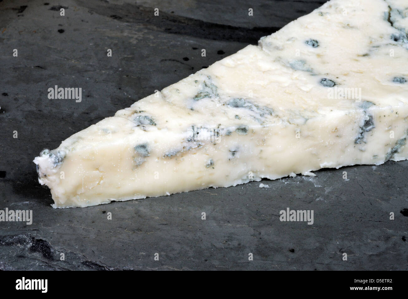 A wedge of Italian Gorgonzola cheese on a piece of Welsh slate Stock Photo  - Alamy