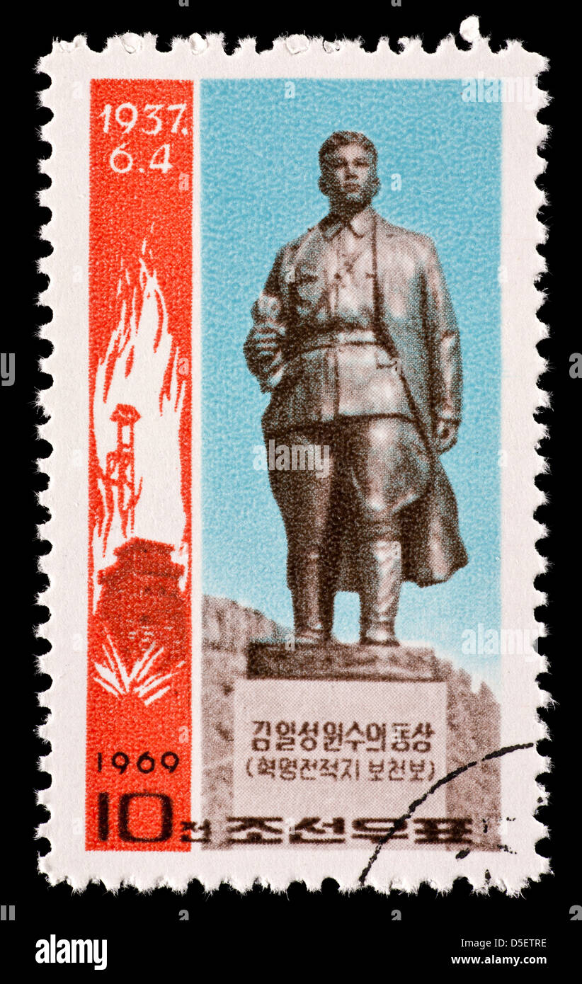 Postage stamp from North Korea depicting a statue of Kim Il Sung on the Ponchonbo battlefield. Stock Photo