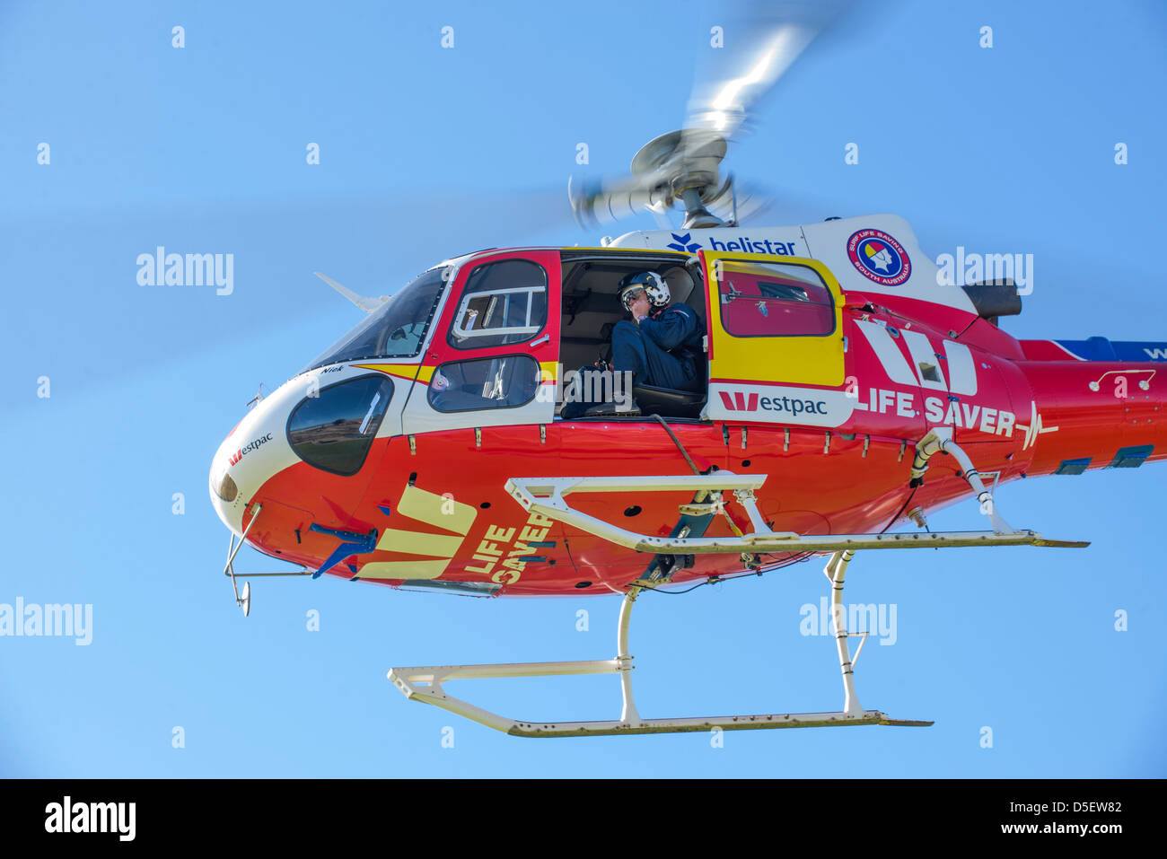 Australian surf rescue helicopter crew training off Moana Beach South Australia. Stock Photo