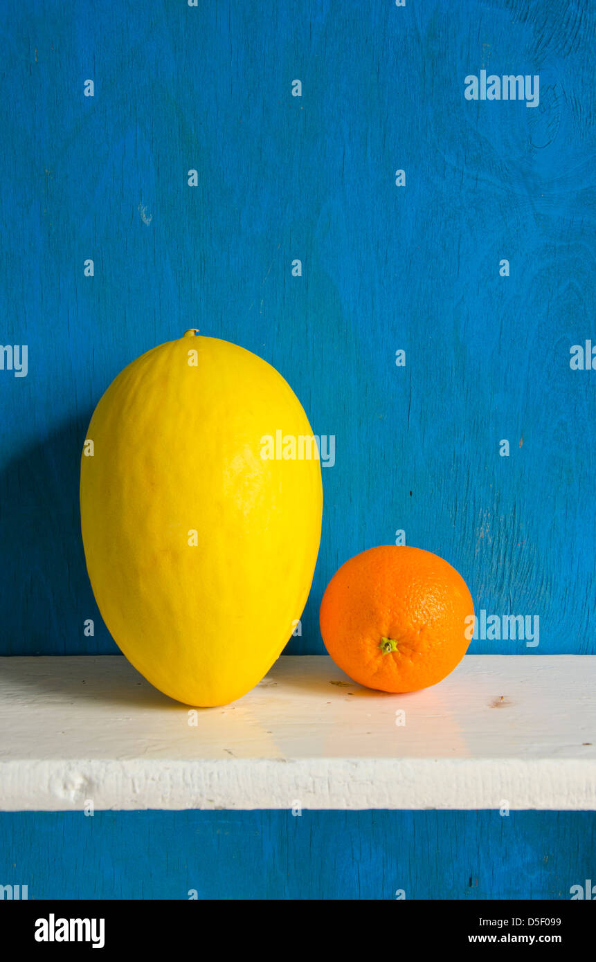 melon and orange fruit on white board Stock Photo
