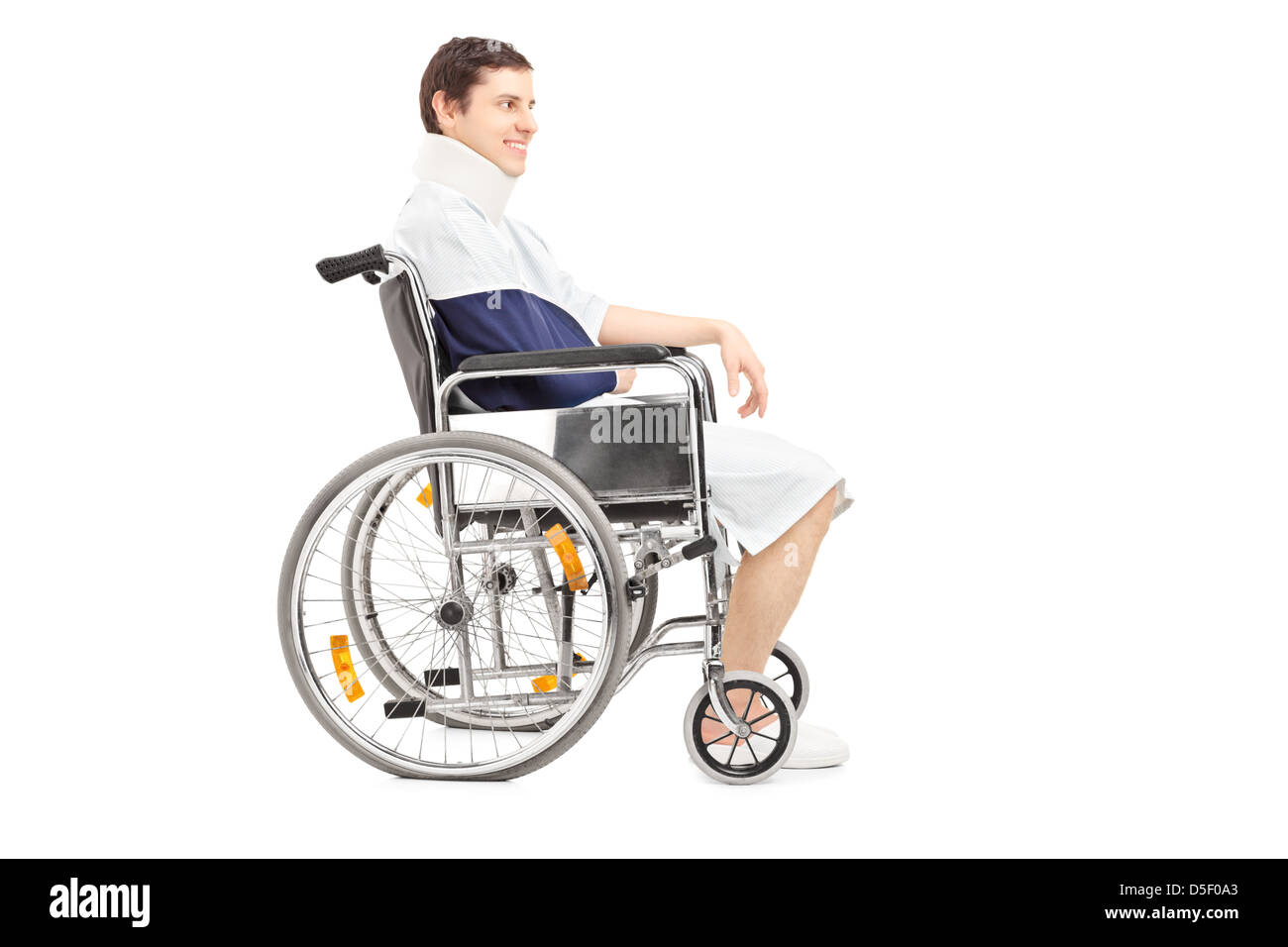 Disabled patient with broken arm in a wheelchair isolated on white background Stock Photo