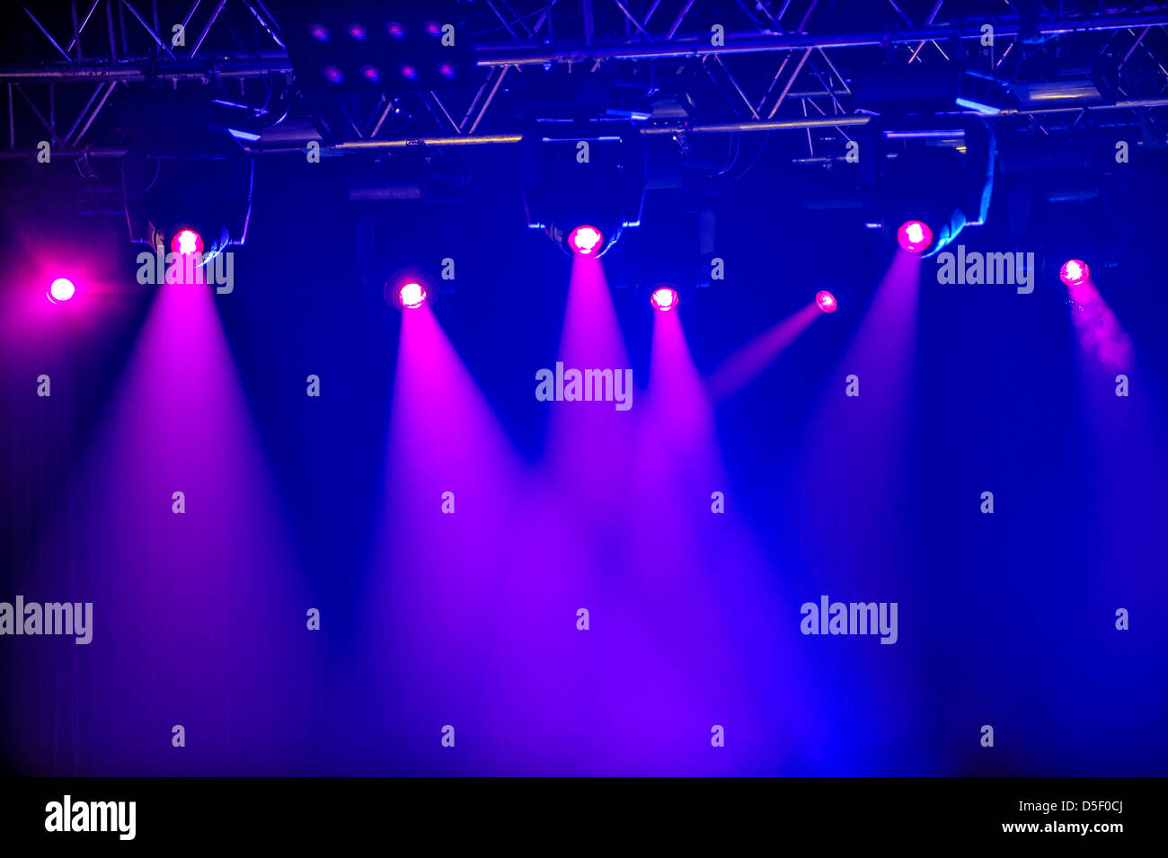 Red spotlights on empty stage Stock Photo