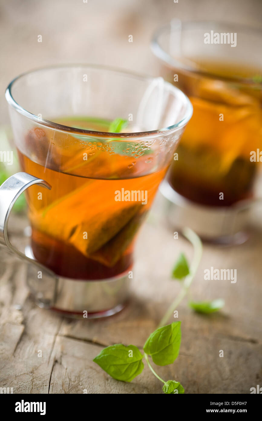 Cup of hot tea with fresh mint leaves Stock Photo