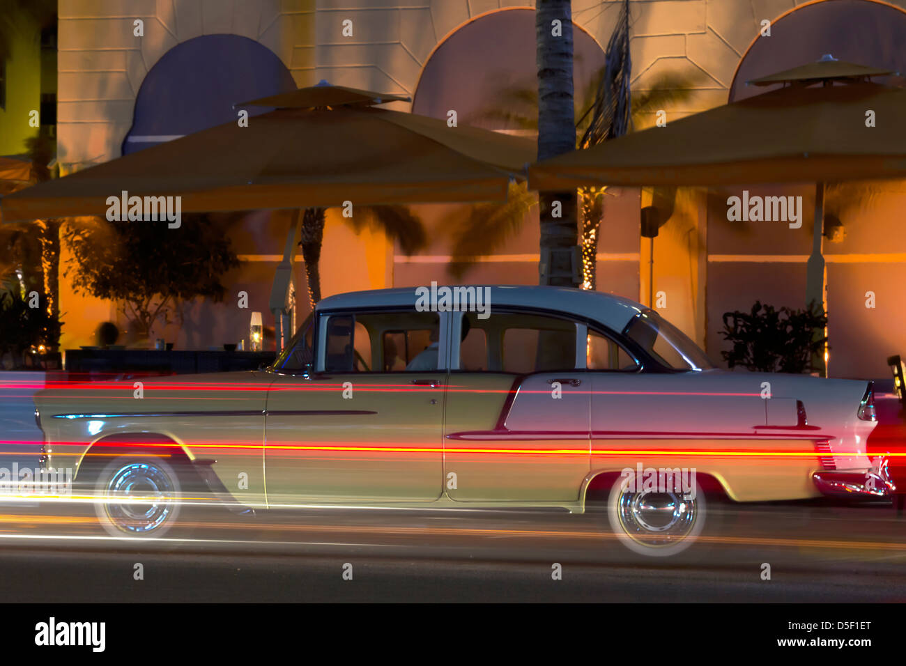 Classic car standing in a parking lot of the Ocean drive of Miami beach Stock Photo