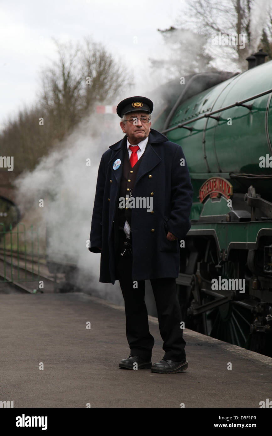 Alresford,UK. 31s March, 2013.  The station master on the platform at Alresford station. Families spend a 'Day out with Thomas' on the Watercress Line during Easter Sunday. The line was originally used to transport fresh watercress to London. Credit: Rob Arnold/Alamy Live News Stock Photo