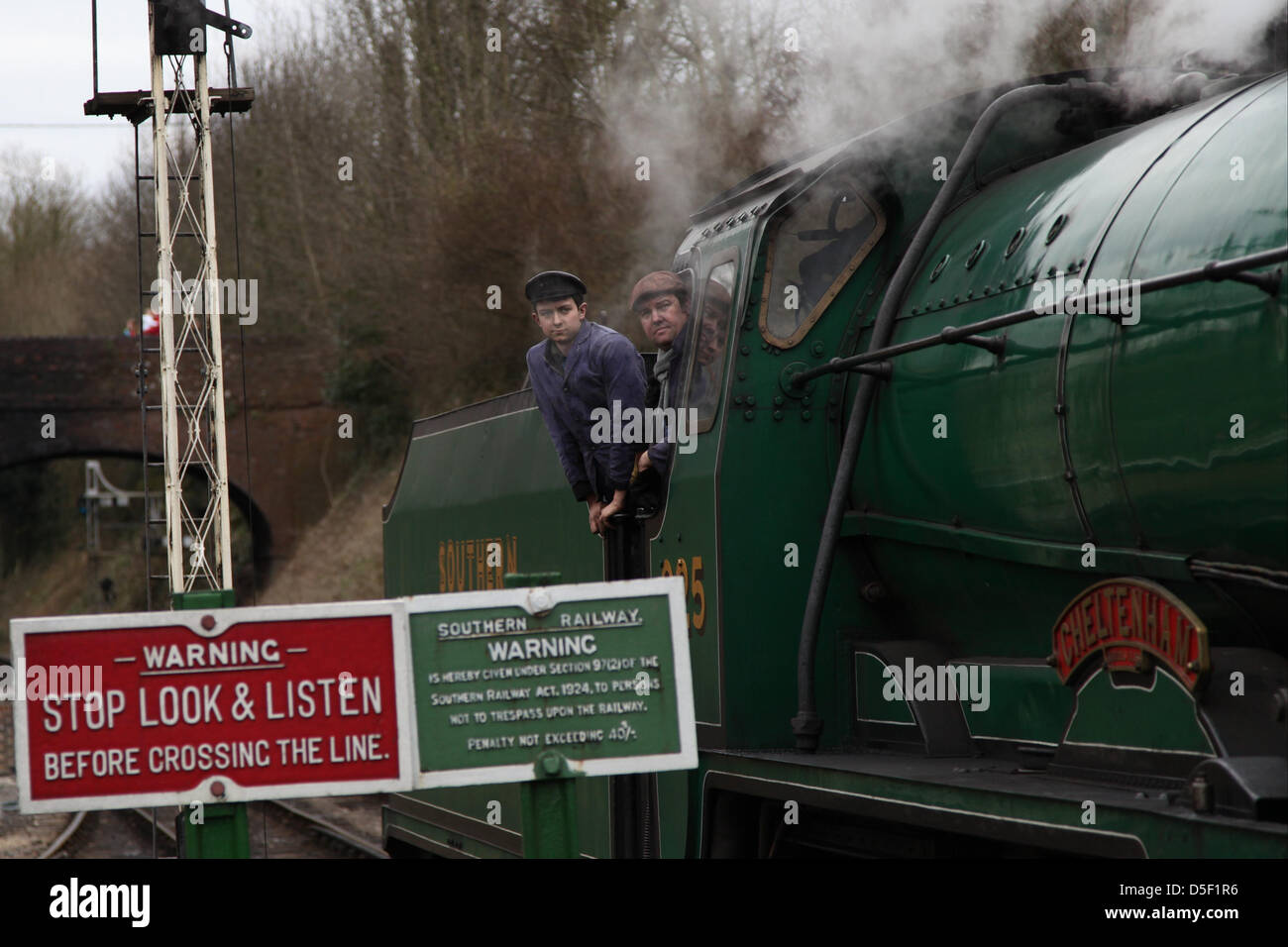 Alresford,UK. 31s March, 2013.  Drivers aboard the steam locomotive as they depart Alresford station. Families spend a 'Day out with Thomas' on the Watercress Line during Easter Sunday. The line was originally used to transport fresh watercress to London. Credit: Rob Arnold/Alamy Live News Stock Photo