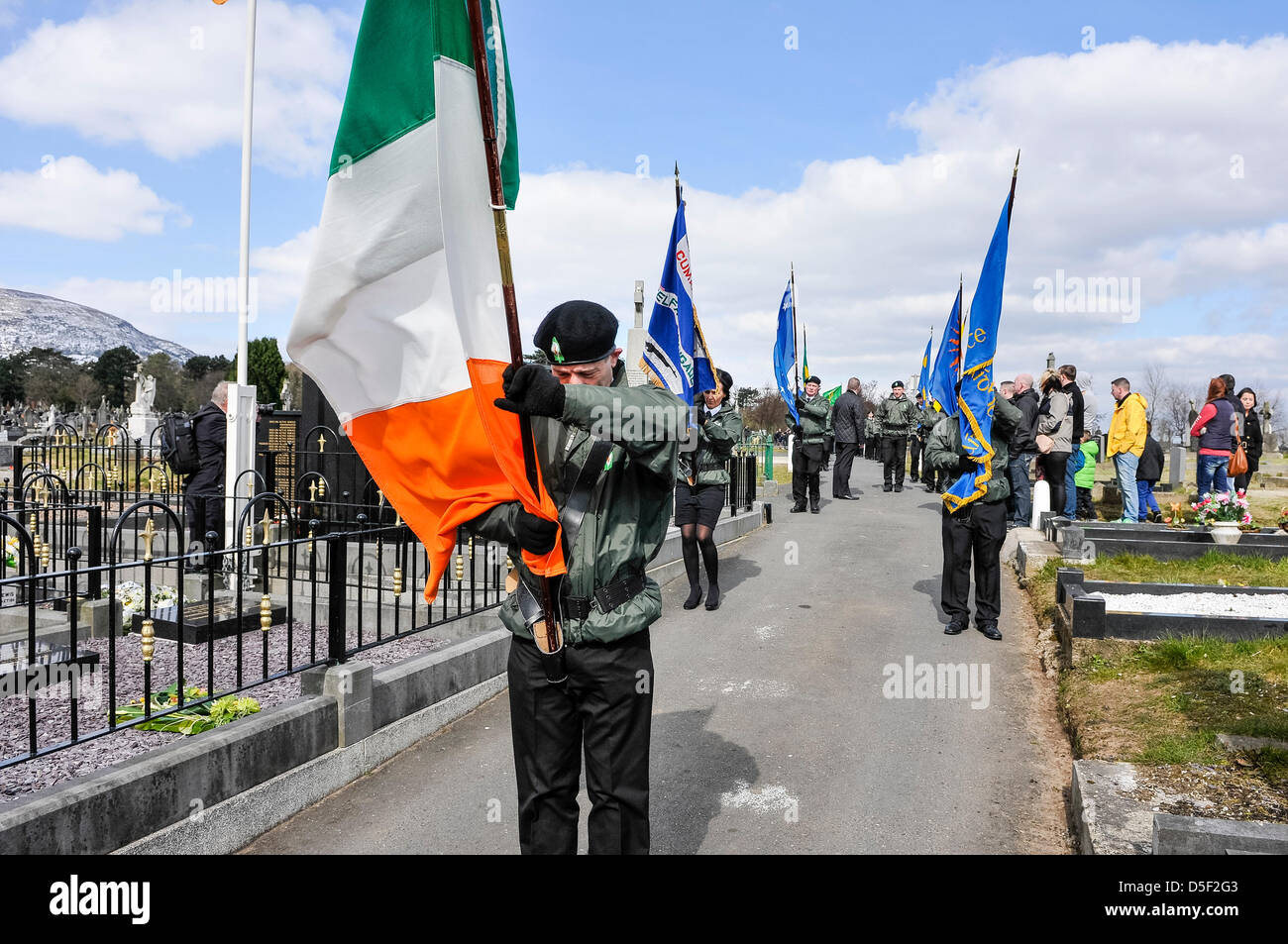 Belfast, Northern Ireland. 31st March, 2013.   The colour party stops ouside the Antrim Republican Memorial Plot as Sinn Fein hold their annual 1916 Easter Rising commemoration Stock Photo