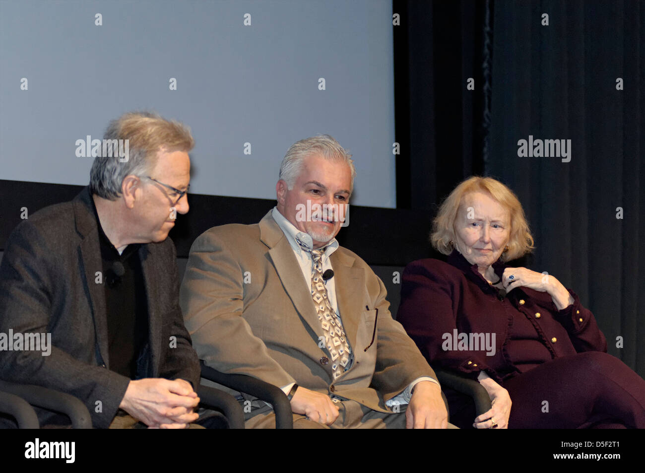 Steve Davis (center) choking back tears while talking about his sister