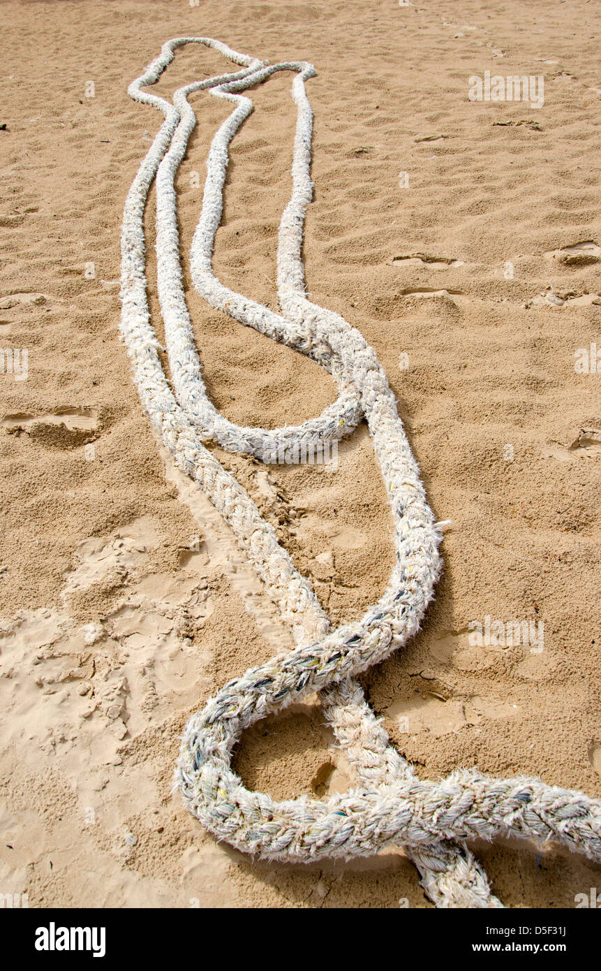 Sand Papper Rope old rope on sea beach sand in resort Stock Photo - Alamy