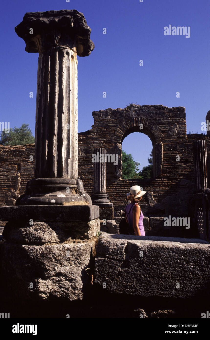 A tourist stands amid workshop of Phidias later turned into Byzantine church in Olympia a sanctuary of ancient Greece in Elis on the Peloponnese peninsula, Stock Photo