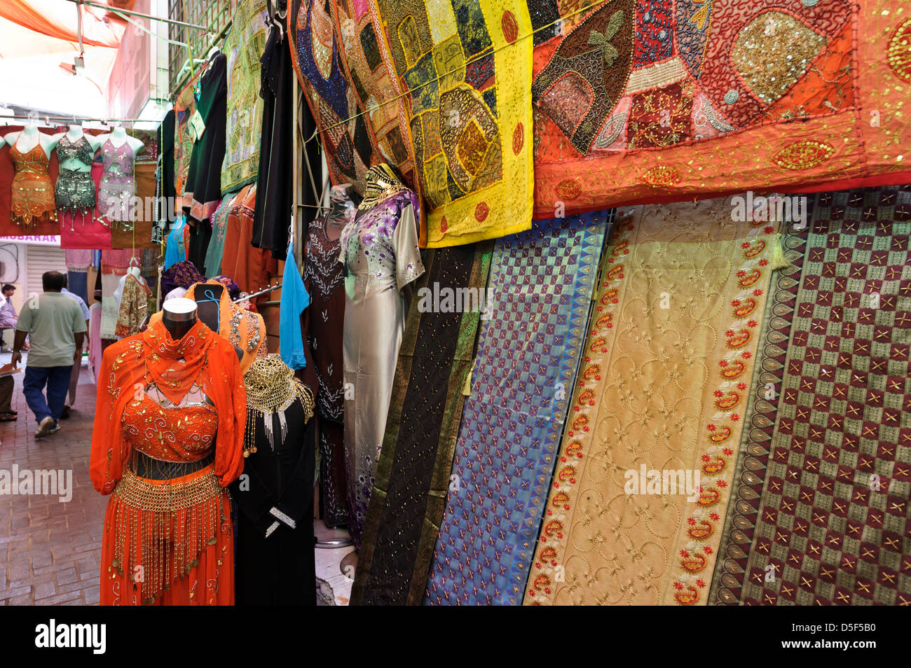 Street market with woman clothes and linen for sale, Dubai, United Arab