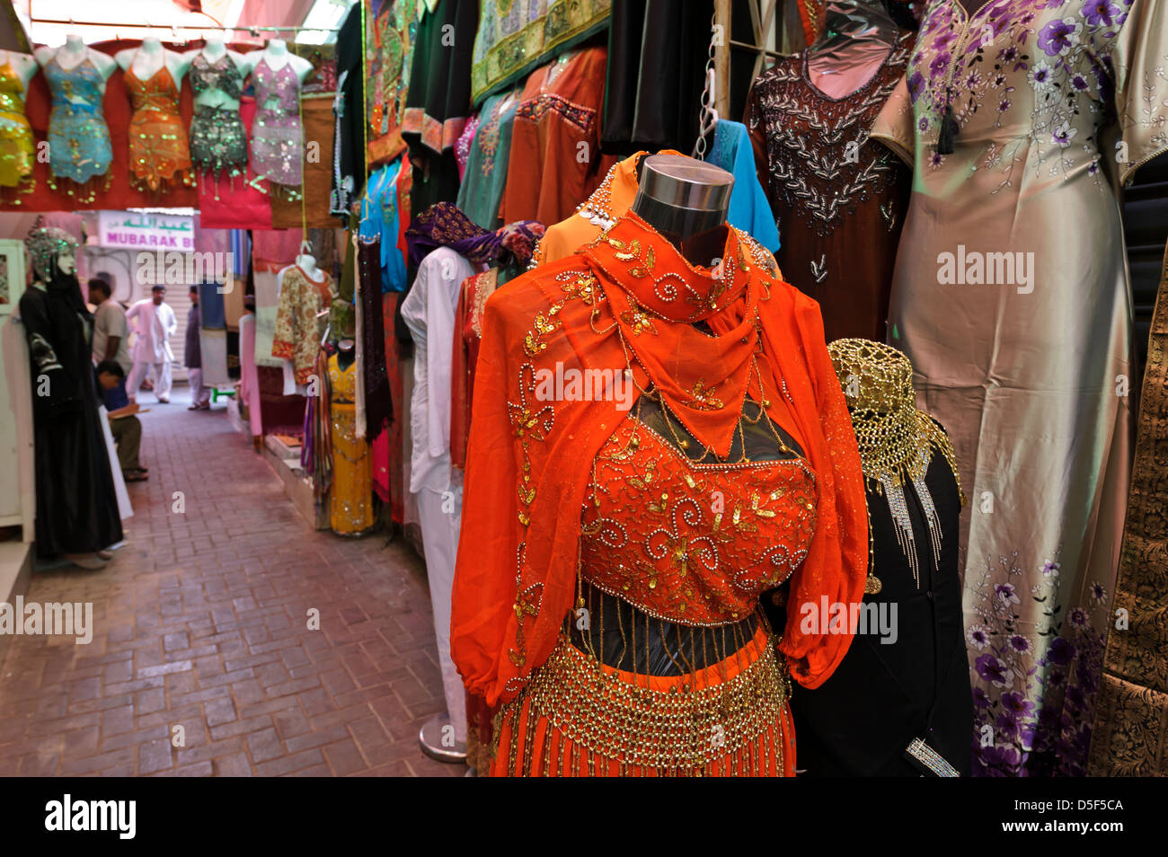 Street market with woman clothes and linen for sale, Dubai, United Arab