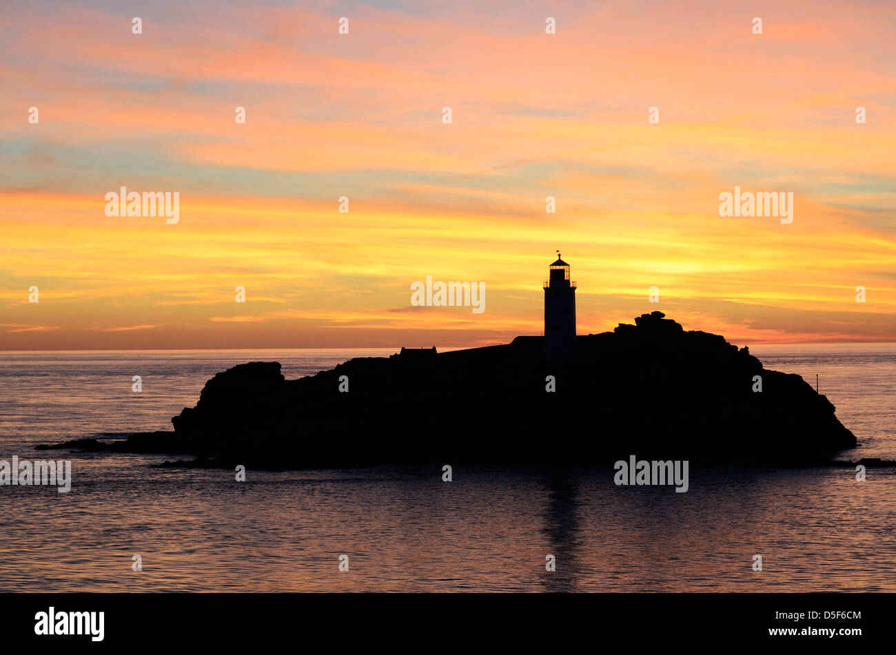Sunset at Godrevy Lighthouse in Cornwall, England, UK Stock Photo