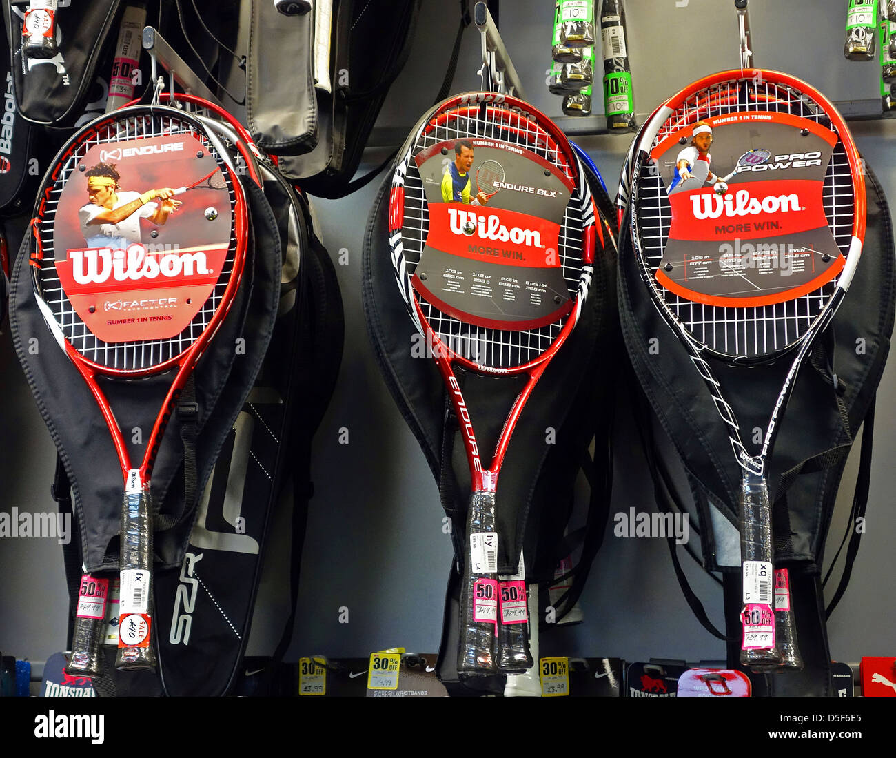 wilson tennis rackets on sale in sports store Stock Photo