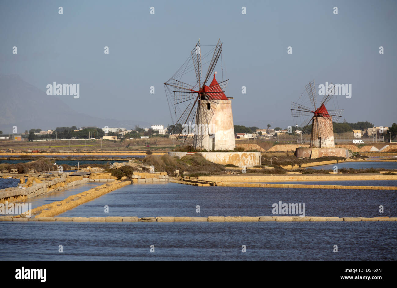 Windmills at Salt Pans in Trapani, Sicily, Italy Stock Photo